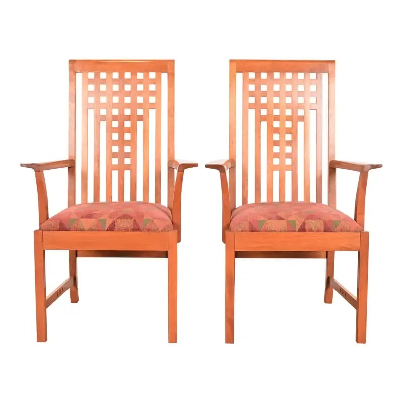 Stickley Mission Arts & Crafts Cherry Wood Armchairs in the Manner of Frank Lloyd Wright, Pair: An exceptional pair of Mission or Arts & Crafts style armchairs or dining captain chairs In the manner of Frank Lloyd Wright By L. & J.G. Stickley USA, 2006 Solid cherry wood frames, with upholstered 