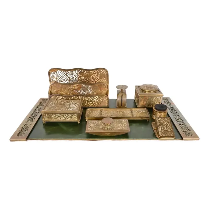 Tiffany Studios New York Pine Needle Bronze Doré and Slag Glass Nine-Piece Desk Set, Circa 1910: A gorgeous antique Arts & Crafts or Art Nouveau period "Pine Needle" gilt bronze and Favrile slag glass desk set. The nine-piece set includes: inkwell, pen brush, letter rack, pen tray, desk box, post