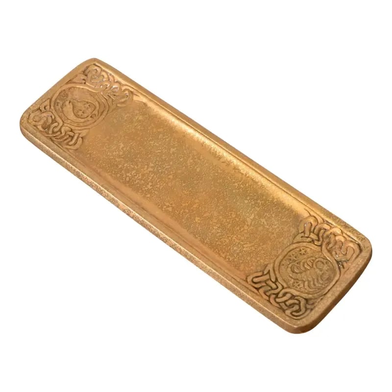 Tiffany Studios New York Zodiac Bronze Doré Pen Tray: A gorgeous antique gilt bronze pen tray featuring Zodiac designs By Tiffany Studios (signed to the underside) New York, USA, Early 20th Century Measures: 10"W x 3.13"D x 0.5"H Very good original vinta