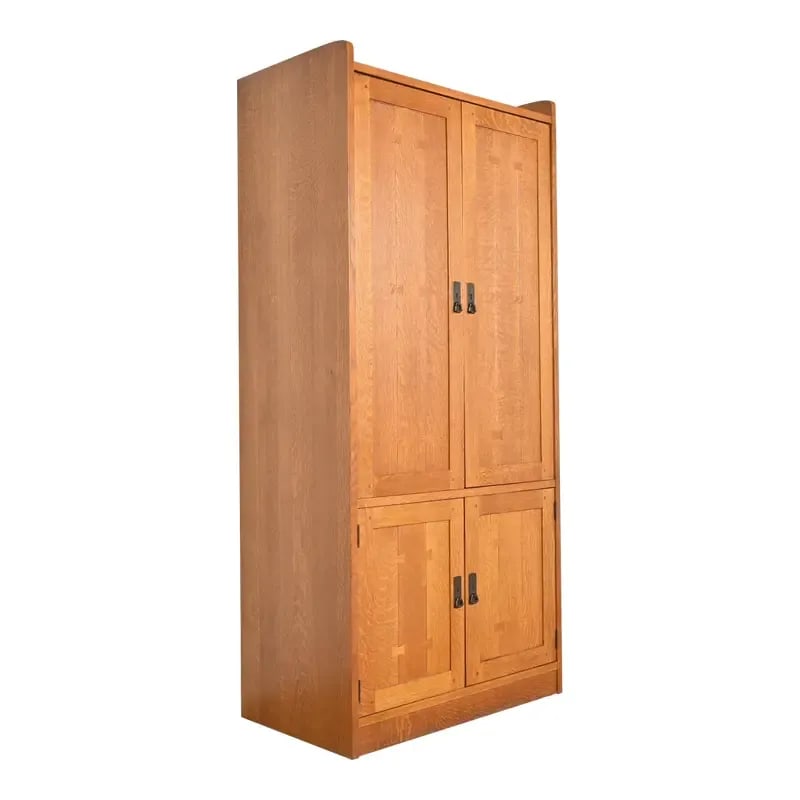 Stickley Mission Oak Arts & Crafts Media Armoire Cabinet: An exceptional Mission or Arts & Crafts style media cabinet or armoire By L. & J.G. Stickley USA, 1990s Solid quarter sawn oak, with butterfly inlay, and hammered copper hardware. Measures: 36.75"W x 