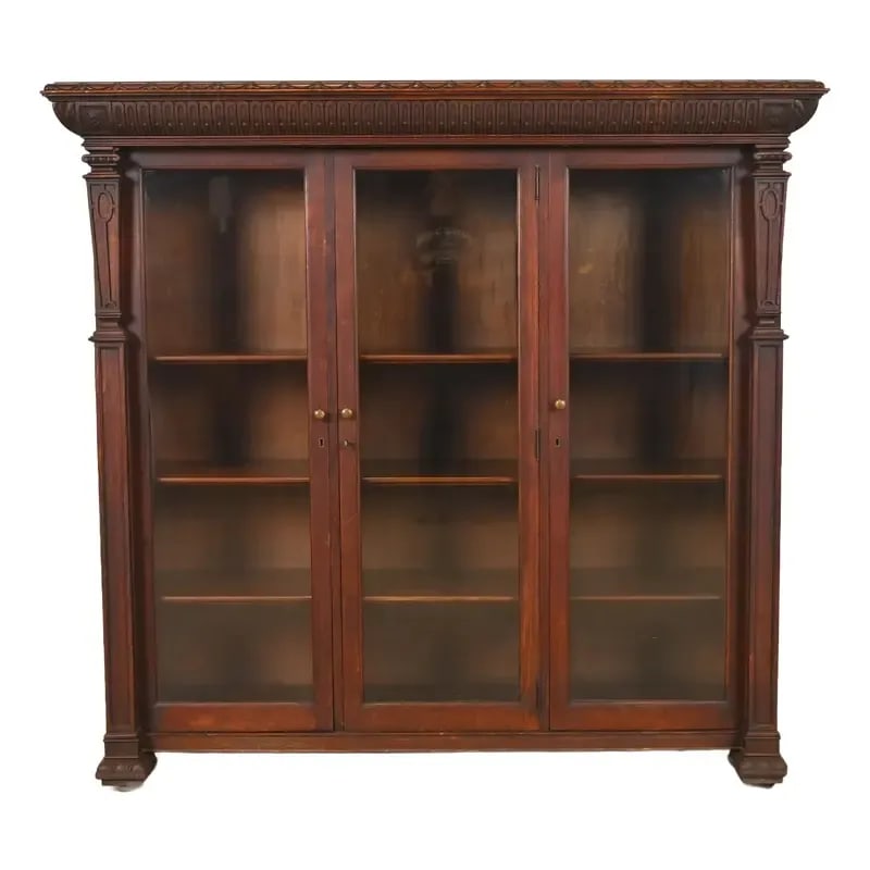 R. J. Horner Style American Empire Carved Oak Glass Front Triple Bookcase Cabinet, Circa 1890: A gorgeous antique American Empire or late Victorian triple bookcase cabinet In the manner of R.J. Horner & Co. USA, Circa 1890 Beautiful carved oak, with glass front doors, and original brass hardwar