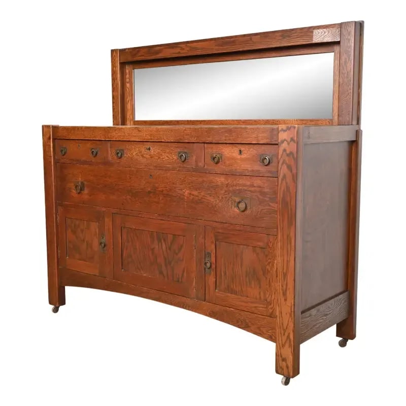 Stickley Brothers Style Antique Mission Oak Arts & Crafts Sideboard or Bar Cabinet, Circa 1900: A gorgeous antique Mission or Arts & Crafts sideboard, buffet server, or bar cabinet In the manner of Stickley Brothers USA, Circa 1900 Oak, with mirrored backsplash, and original hammered copper hard