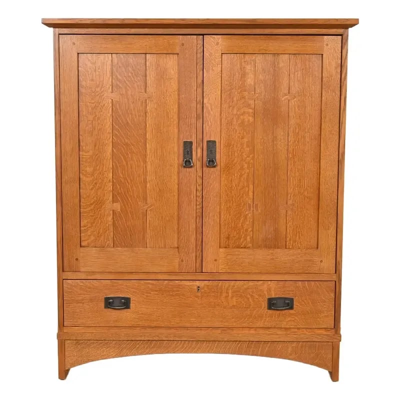 Stickley Mission Oak Arts & Crafts Media Cabinet: A beautiful Mission or Arts & Crafts media cabinet or armoire By L. & J.G. Stickley USA, Late 20th Century Solid quarter sawn oak, with original hammered copper hardware. Measures: 42.88"W x 23"D x 51