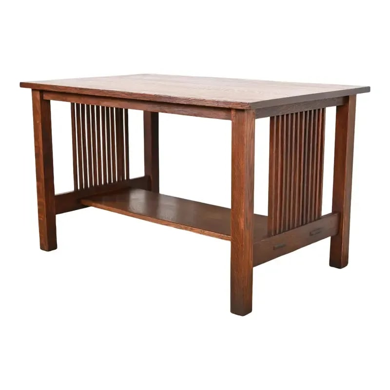 Gustav Stickley Mission Oak Arts & Crafts Spindle Writing Desk or Library Table, Circa 1900: A rare and exceptional antique Mission or Arts & Crafts quarter sawn oak spindle writing desk or library table By Gustav Stickley USA, Circa 1900 Measures: 48"W x 29.75"D x 28.88"H. Very good original