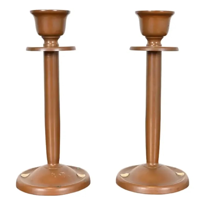 Benedict Studios Arts & Crafts Bronze Candlesticks, Circa 1910: A gorgeous pair of Arts & Crafts period bronze candlesticks with emblems of classical Greek figures. By Benedict Studios (each signed to the underside) USA, Circa 1910 Each measures: 3.5"W x 3.5"D x 8