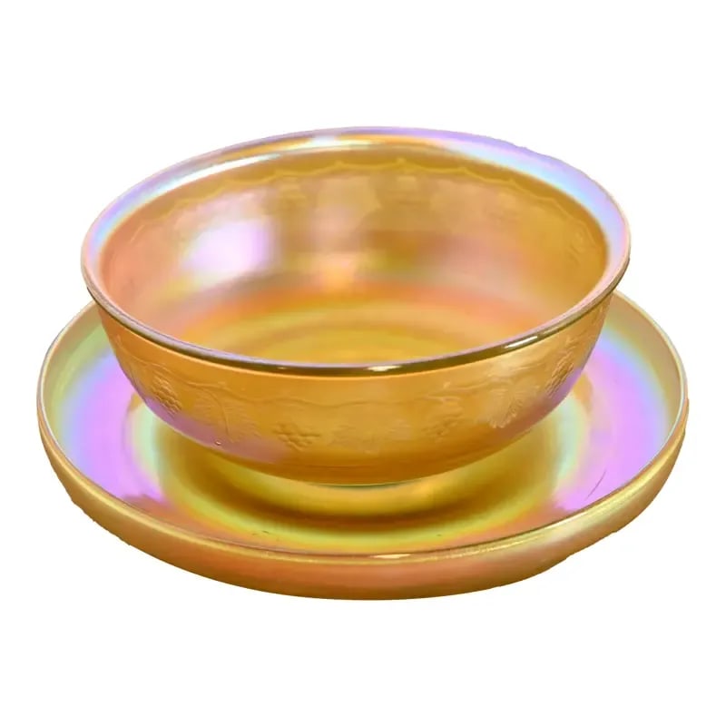Louis Comfort Tiffany Favrile Iridescent Art Glass Bowl and Underplate With Intaglio Grapevine Motif: A gorgeous Arts & Crafts or Art Nouveau period Favrile iridescent art glass bowl and underplate with intaglio grapevine motif By Louis Comfort Tiffany for Tiffany Studios (both pieces signed to the un