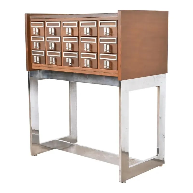 Mid-Century Modern Walnut and Chrome 15-Drawer Library Card Catalog: A rare Mid-Century Modern 15-drawer library card catalog or file cabinet USA, Mid-20th Century Walnut, with durable laminate top, and chrome base. Measures: 35"W x 19.5"D x 41.75"H. Drawer interiors m