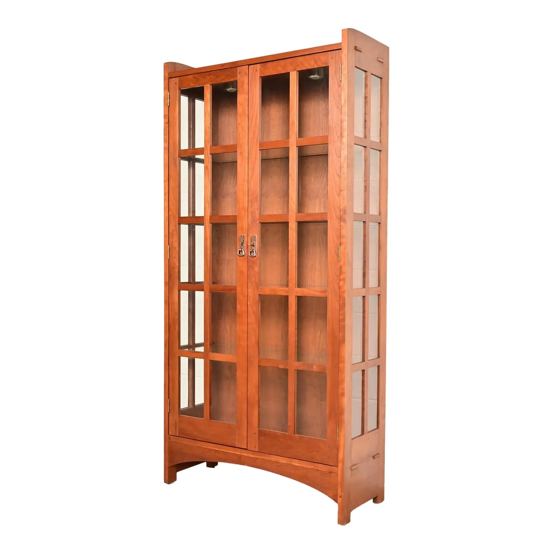 Stickley Mission Arts and Crafts Cherry Wood Lighted Bookcase Cabinet or Display Cabinet: A beautiful Mission or Arts & Crafts bookcase or display cabinet By Stickley USA, 1997 Cherry wood, with mullioned glass doors and sides, and original hammered copper hardware. Measures: 38"W x 15"D x