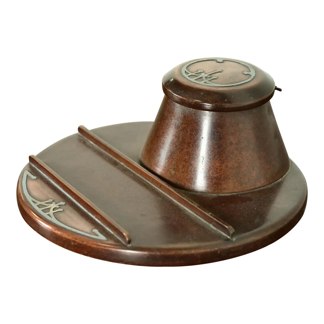Heintz Arts & Crafts Sterling Silver on Bronze Inkwell With Pen Tray: A gorgeous Arts & Crafts period sterling silver on bronze inkwell with pen tray By Heintz Art Metal Shop USA, Early 20th Century Patinated bronze, with sterling silver inlay. Measures: 7"W x 7"D x 2.7