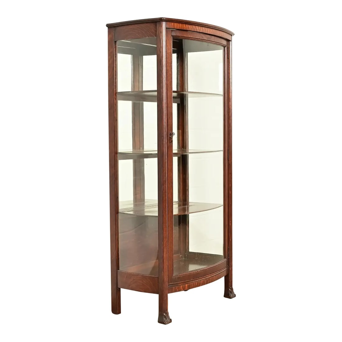 Berkey & Gay Antique Victorian Carved Oak Bookcase or Display Cabinet, Circa 1890s: A beautiful antique Victorian, American Empire, or Arts & Crafts bow front bookcase, china cabinet, or display cabinet By Berkey & Gay USA, Circa 1890s Carved quarter sawn oak, with glass door and sid