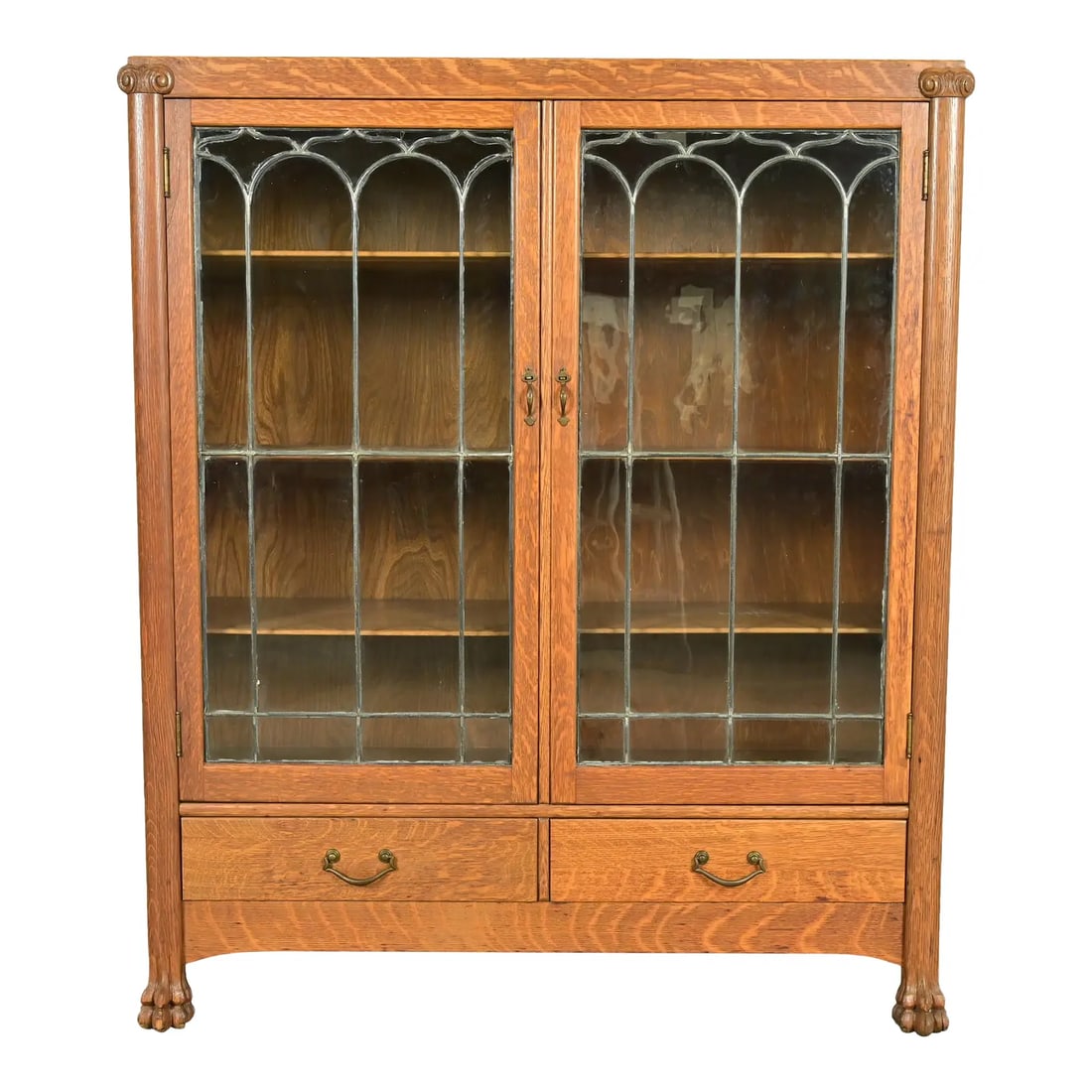 R. J. Horner Style Antique American Empire Carved Tiger Oak Double Bookcase Cabinet: A gorgeous American Empire or Victorian double bookcase cabinet In the manner of R.J. Horner & Co. USA, Circa 1890s Tiger oak, with carved lion paw feet, mullioned leaded glass front doors, and origin
