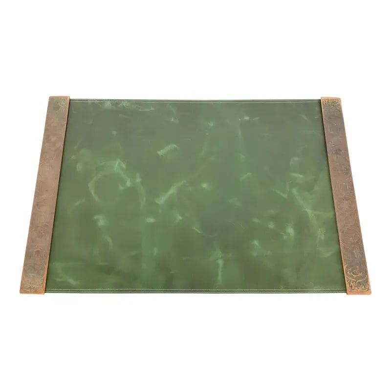 Early 20th Century Tiffany Studios New York Zodiac Bronze Blotter Ends With Leather Desk Pad: A gorgeous pair of Art Deco or Arts & Crafts period patinated bronze blotter ends featuring symbols of the Zodiac with a custom green leather desk pad By Tiffany Studios (signed to the underside) New 