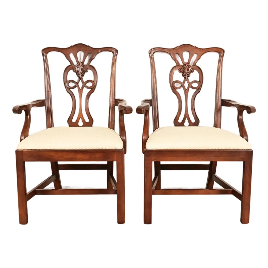Henredon Georgian Carved Mahogany Armchairs, Pair: A gorgeous pair of Georgian or Chippendale style armchairs or dining captain chairs By Henredon USA, Circa 1980s Carved mahogany frames, with upholstered seats. Measures: 26.5"W x 23.5"D x 39.75"H. Se