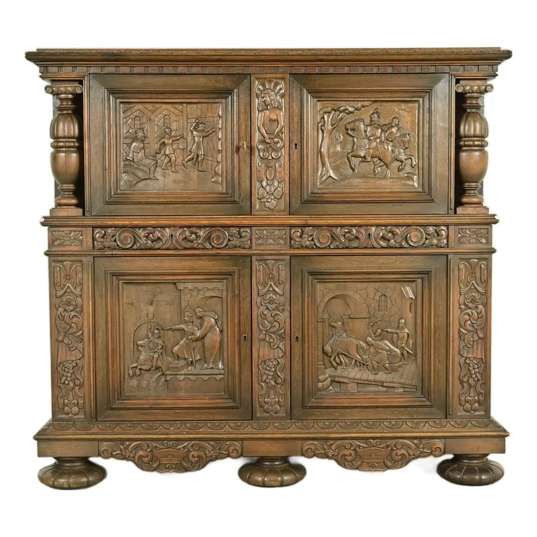 Antique Danish Renaissance Revival Carved Oak Bar Cabinet, Circa 1890s: An exceptional antique Victorian or Renaissance Revival ornate carved oak cupboard or bar cabinet In the manner of R.J. Horner & Co. Denmark, Circa 1890s Oak, with ornate carvings depicting the life a