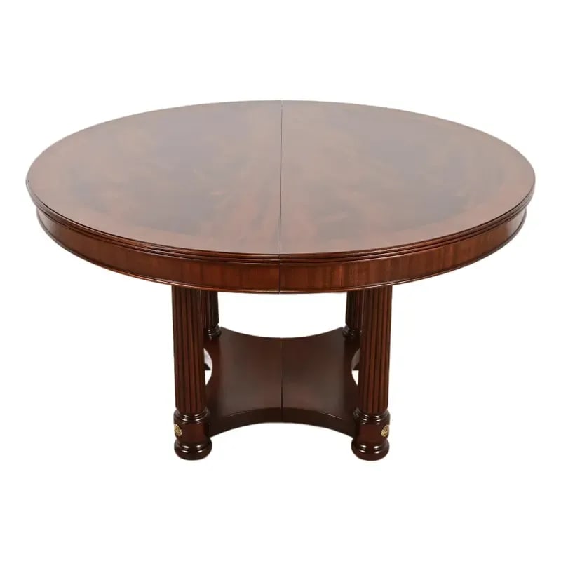 Henkel Harris Empire Banded Flame Mahogany Pedestal Extension Dining Table, Newly Refinished: A gorgeous Biedermeier, Neoclassical, Empire, or Regency style split pedestal extension dining table By Henkel Harris USA, 1995 Gorgeous book-matched banded flame mahogany top, with carved solid mahog