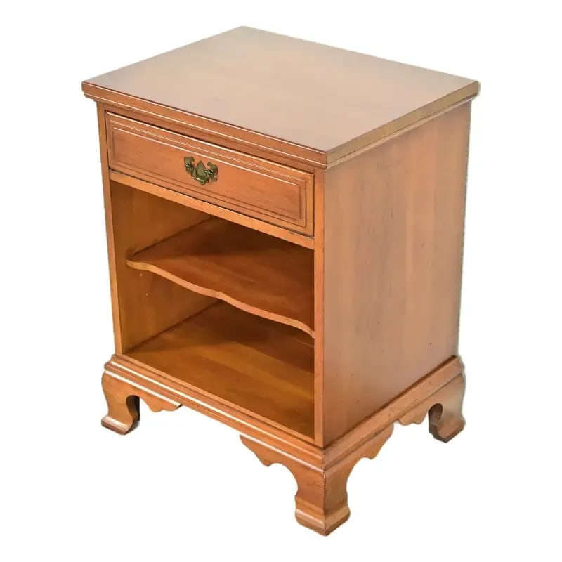 Davis Cabinet Co. American Colonial Chippendale Carved Solid Cherry Wood Nightstand, Circa 1960s: A beautiful Early American or Colonial Chippendale style nightstand or end table By Davis Cabinet Co. USA, Circa 1960s Carved solid cherry wood, with original brass hardware. Measures: 22"W x 17"D x 2