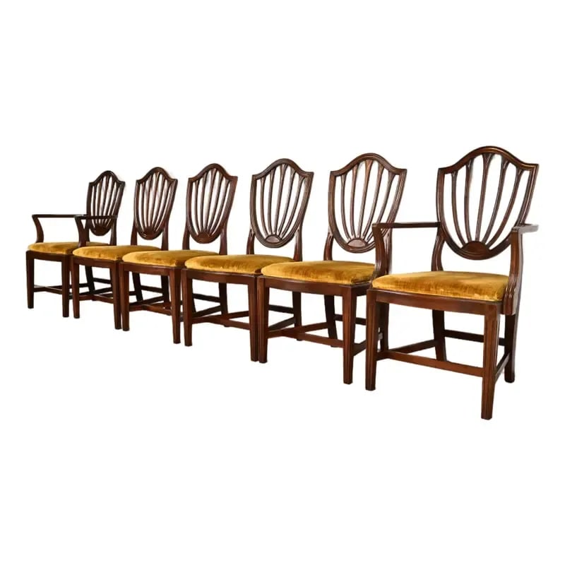Ethan Allen Federal Mahogany Shield Back Dining Chairs, Set of Six: A gorgeous set of six Federal or Hepplewhite style shield back dining chairs By Ethan Allen USA, Circa 1970s Solid carved mahogany frames, with upholstered seats. Measures: Side chairs - 21.25"W x 22.
