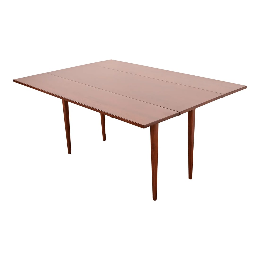 Jack Cartwright for Founders Mid-Century Modern Walnut Drop-Leaf Harvest Dining Table: A sleek and stylish Mid-Century Modern solid walnut drop-leaf harvest dining table By Jack Cartwright for Founders Furniture USA, 1960s Measures: 60"W x 42.5"D x 29"H. With leaves down, depth is 20.25
