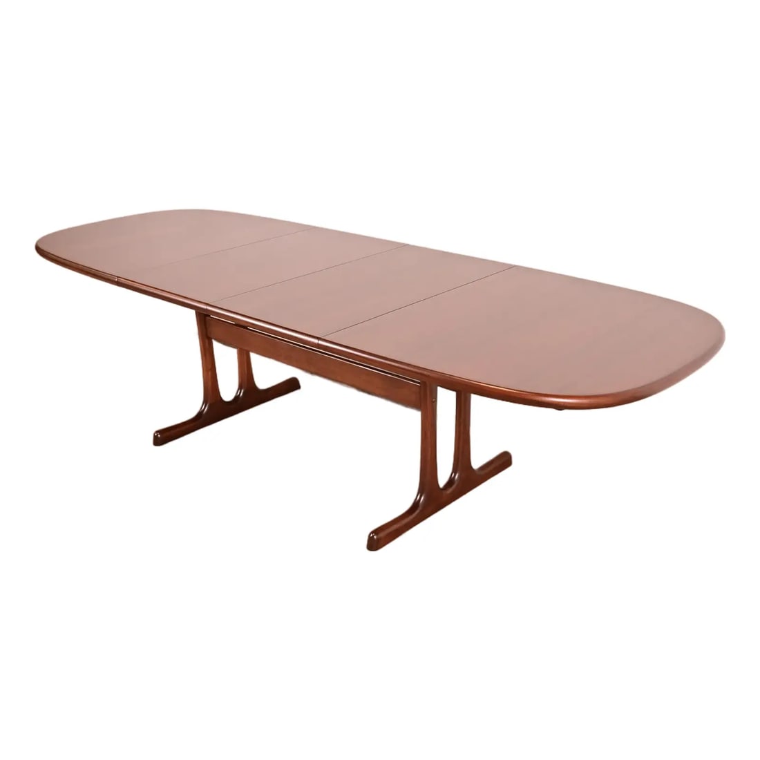 Niels Otto Møller Style Danish Modern Sculpted Rosewood Extension Dining Table, Newly Refinished: A sleek and stylish mid-century Danish Modern sculpted rosewood extension dining table In the manner of Niels Otto Møller Denmark, Circa 1960s Measures: 68.5"W x 39"D x 28.5"H. Extends up to 108"W wi