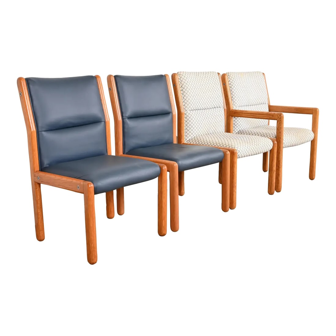 Dunbar Mid-Century Modern Solid Oak Dining Chairs, Set of Four: A nice set of four Mid-Century Modern dining chairs By Dunbar Furniture USA, 1970s Solid oak frames, with upholstered seats and backs. Two chairs with high end blue leather upholstery. Measures: Side 
