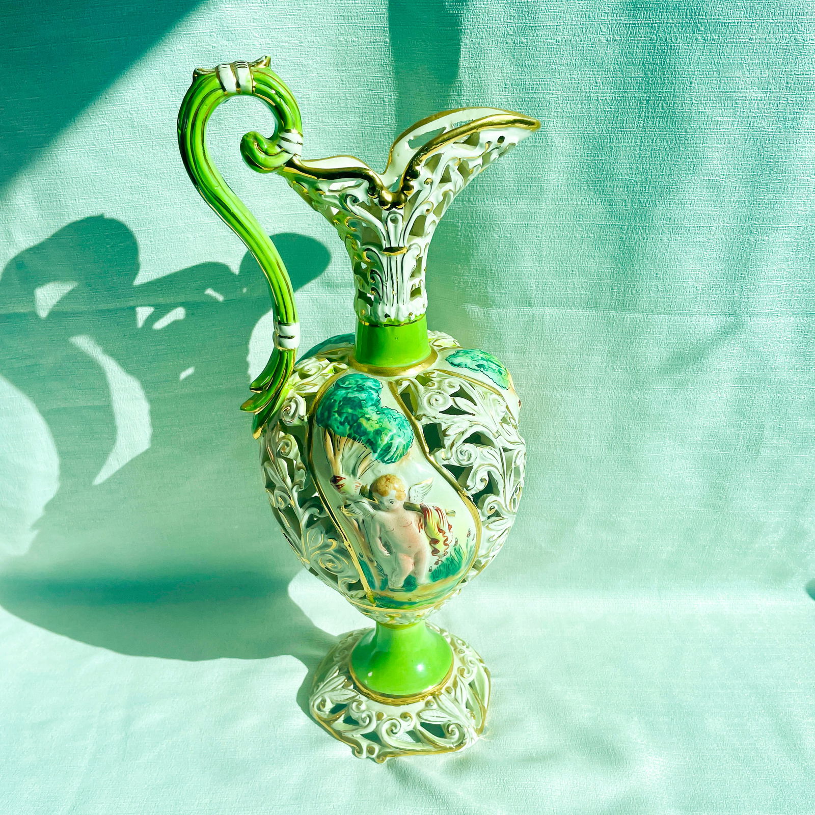 Capodimonte Cherub Italian Roman Pitcher Vase with Unglazed Feet #1066: Dimensional pitcher with negative space and gorgeous hand painting. 17" tall x 8" wide