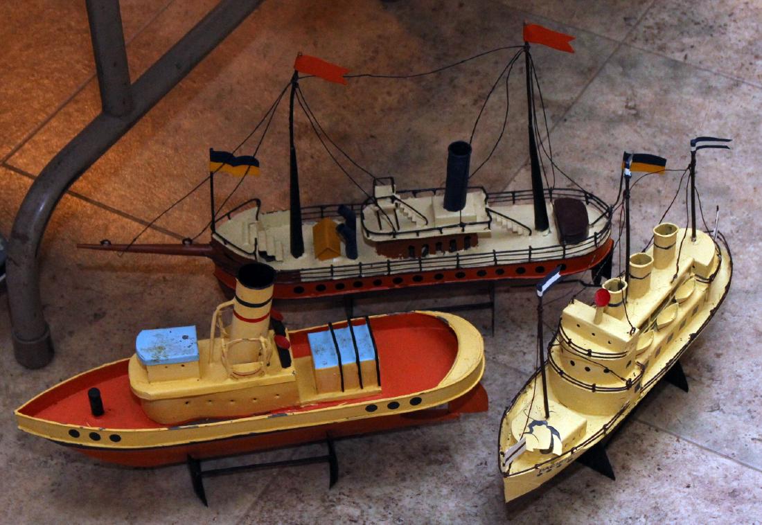 set of 3 tin steamer ship models; average 15" x 10";: set of 3 tin steamer ship models; average 15" x 10"; showing some losses of paint