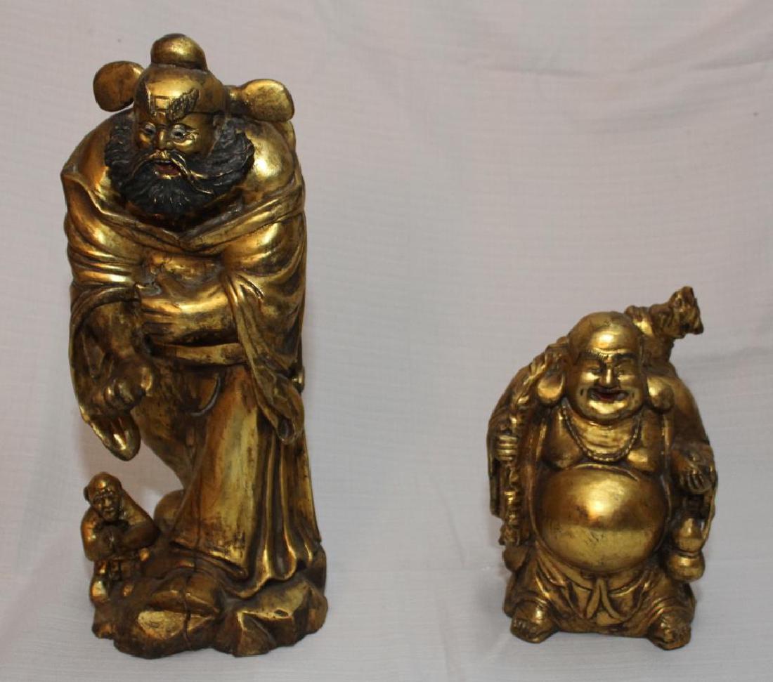 2 Chinese wood carved gilt decorates statues, 1 wiseman: 2 Chinese wood carved gilt decorates statues, 1 wiseman 7.5" wide x 17.5" high having slight separation, 1 happy fat man 7" wide x 10.5" high having slight separation