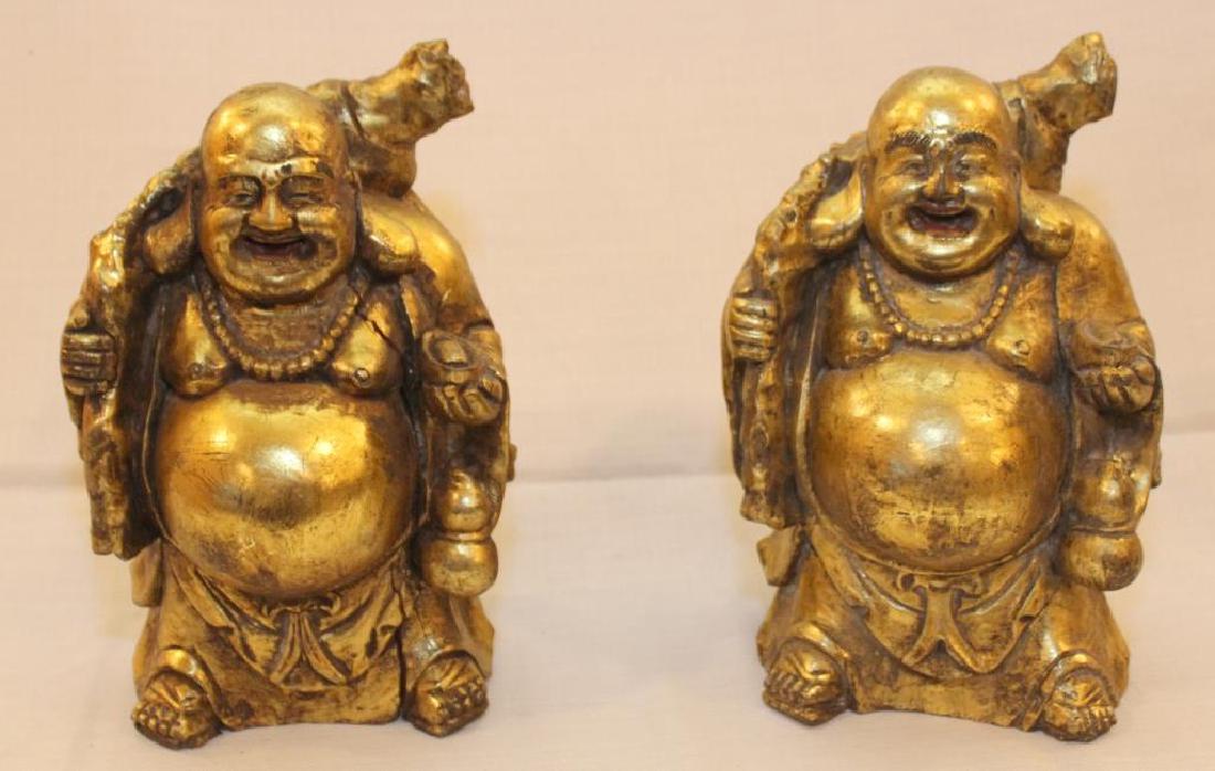 pair Chinese wood carved gilt decorated happy fat men: pair Chinese wood carved gilt decorated happy fat men showing light separation, 6.5" wide x 10.5" high
