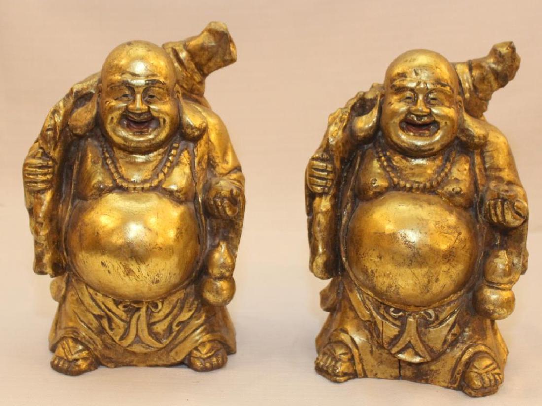 pair Chinese wood carved gilt decorated happy fat men: pair Chinese wood carved gilt decorated happy fat men showing light separation, 6.5" wide x 10.5" high