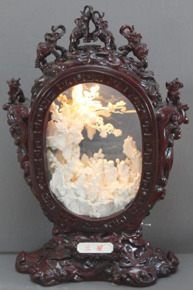 Chinese carved and veneered bone diorama with: Chinese carved and veneered bone diorama with Immortals, modern, wired for electricity. Height 23"; possible small breaks, chips, cracks, repairs or losses with possible composition elements