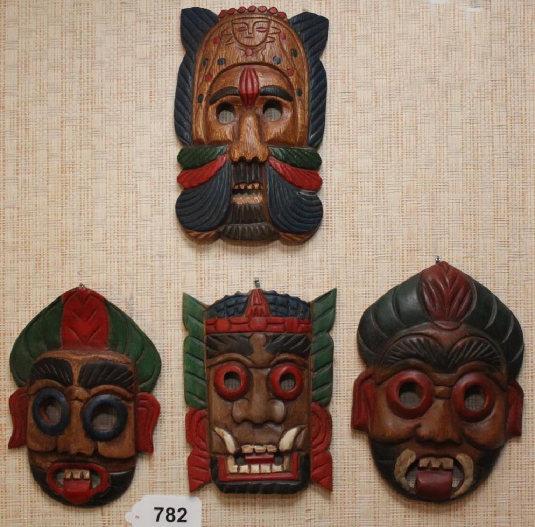 (4) Thai wood carved masks 8.5" x 6": (4) Thai wood carved masks 8.5" x 6"