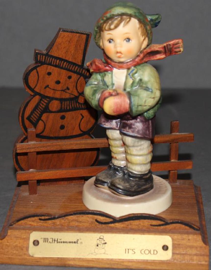 Hummel figure "It's Cold" #421 1981 on wooden base with: Hummel figure "It's Cold" #421 1981 on wooden base with snowman, Exclusive Edition No. 6 for members of the Goebel Collectors club, 5.25"
