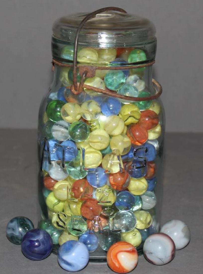 "Atlas" glass lid quart jar full of glass cat's eye (1 of 1)