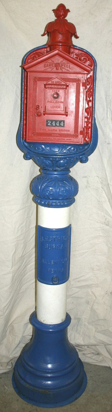 Gamewell Police, Fire Call boxes: Old Gamewell original Police and Fire Call boxes each mounted on opposite sides of the same orig iron post with ornate iron cap and mounting frame. Interior working components are still there. Iron ca