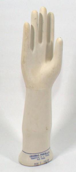 porcelain hand glove display, signed "General: porcelain hand glove display, signed "General Porcelain Trenton NJ June 1 1971", 14" tall
