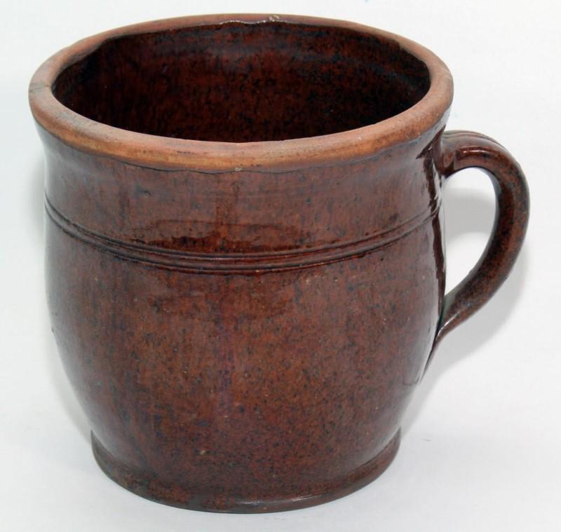 glazed redware one handle crock, 6.5" high w/7": glazed redware one handle crock, 6.5" high w/7" diameter, 2" hairline crack at top