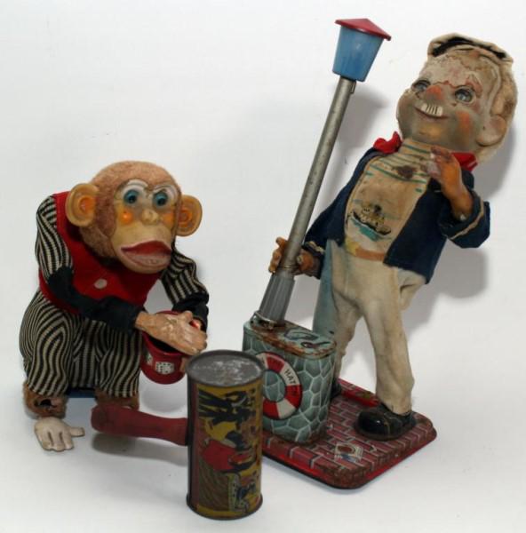 (2) battery operated toys - "Down the Hatch" &: (2) battery operated toys - "Down the Hatch" & "Monkey with Dice Cup"; both in poor condition; and noise maker