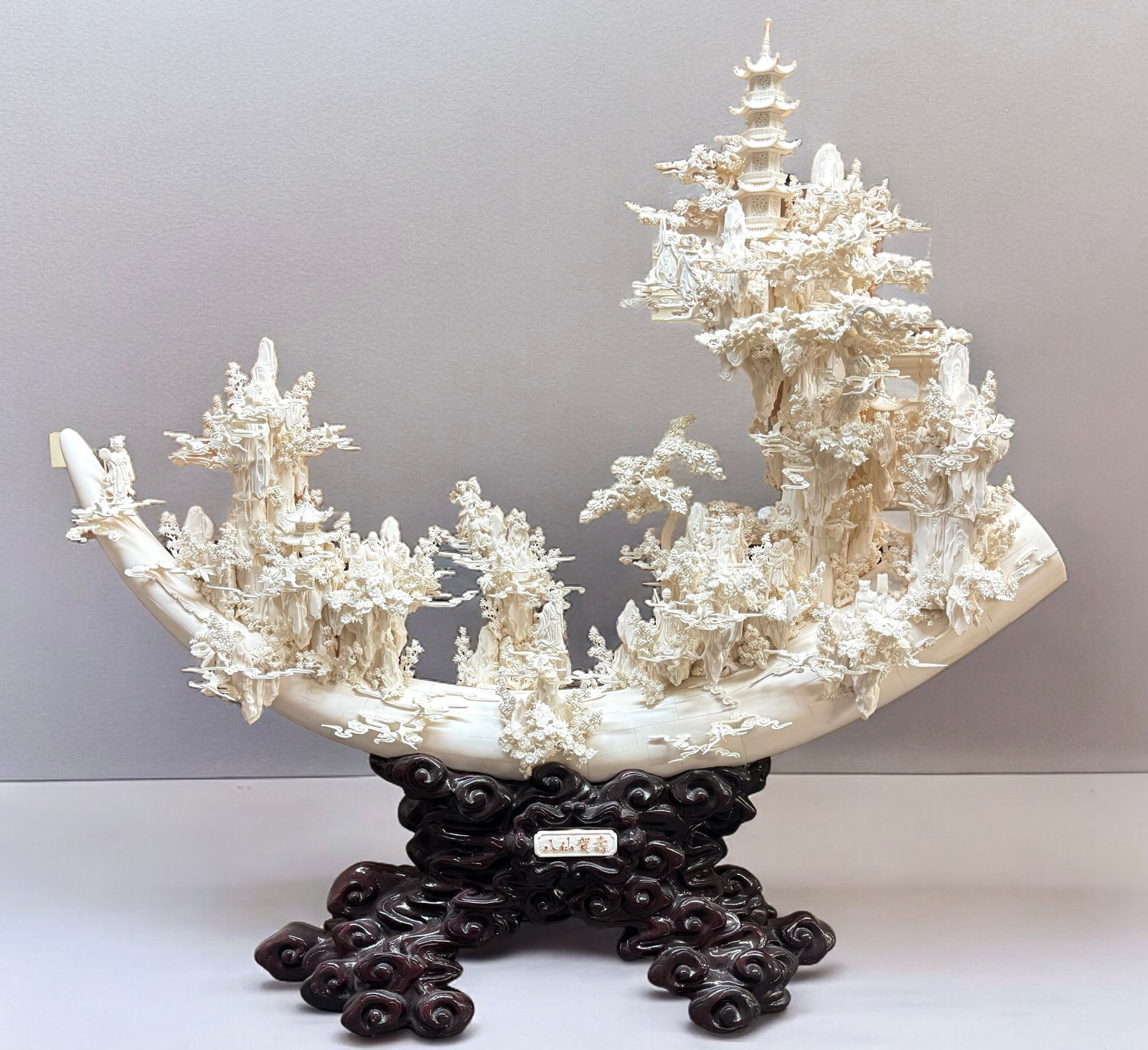 STUNNING Lrg Detailed Tusk/Bone Carving: Imported with a Federal Fish & Wildlife License dated 2003-2004. STUNNING large intricate hand carved and tessellated piece atop a lacquered carved root wood stand. This massive intricate tusk form de
