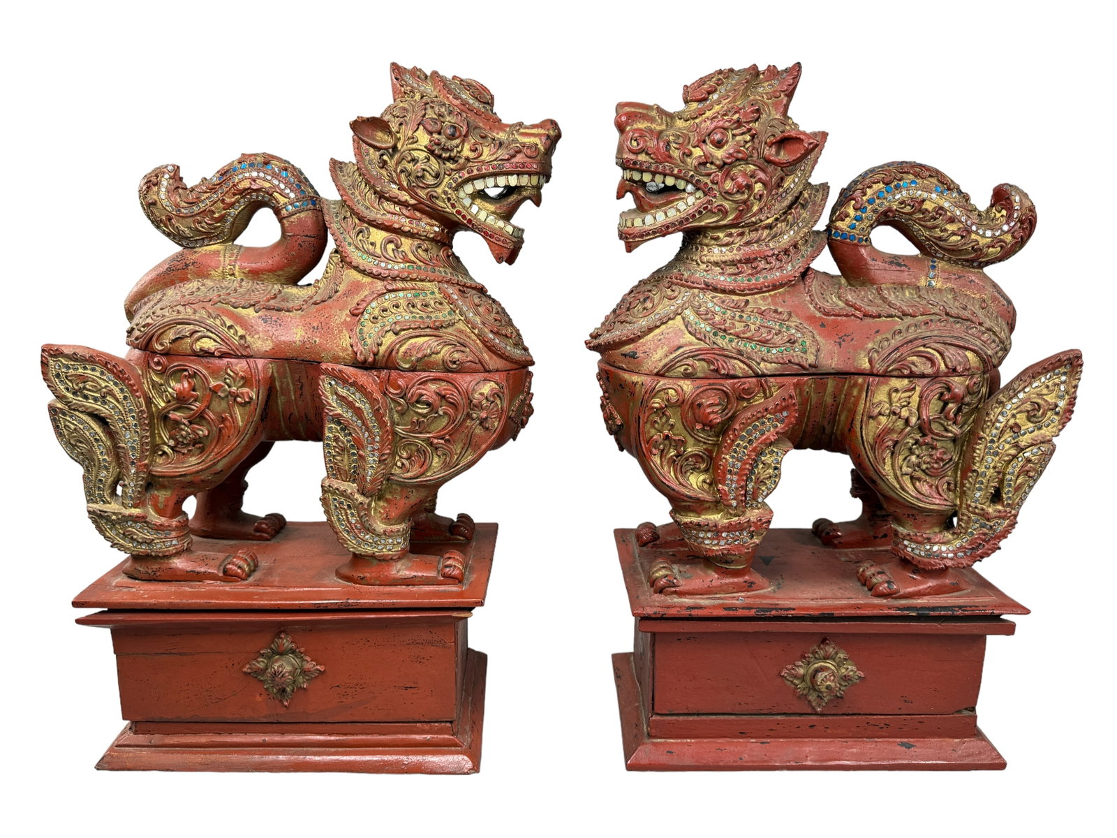 Temple Foo Dogs MOP Adorned Boxes: Unique lacquered carved wood in an antiqued patina with mother of pearl teeth and several colored glass and MOP pieces throughout. Bottom drawer and mid body lift to reveal storage area. Both have min