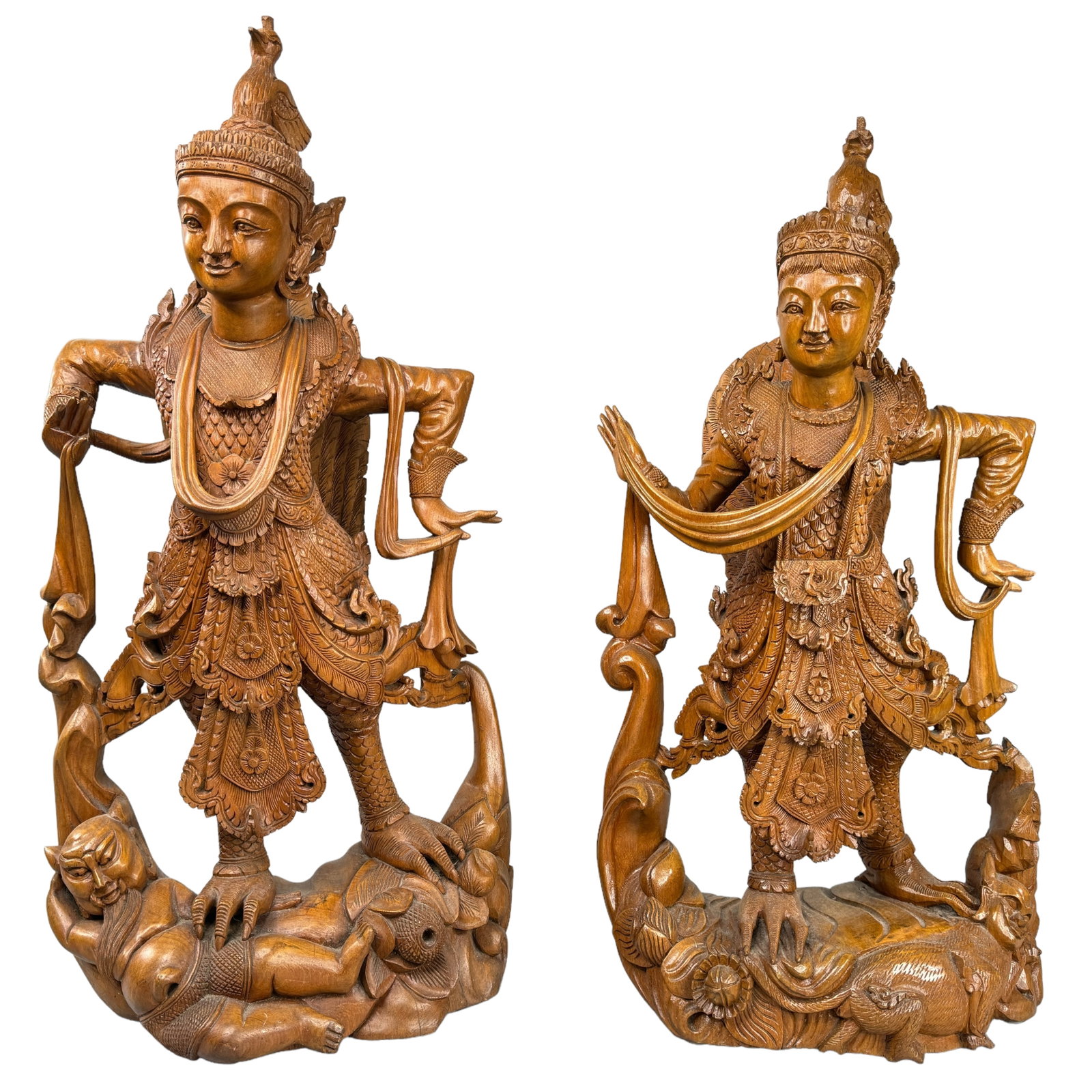 Carved Wood Burmese Kinnara Style Statues: Vintage Burmese style carved wood dancing figures, appears as sandalwood. Both depict a half bird, and half woman figure in dance reflecting the Burmese myth of Kinnara. Each stand 24 & 26 inches tall
