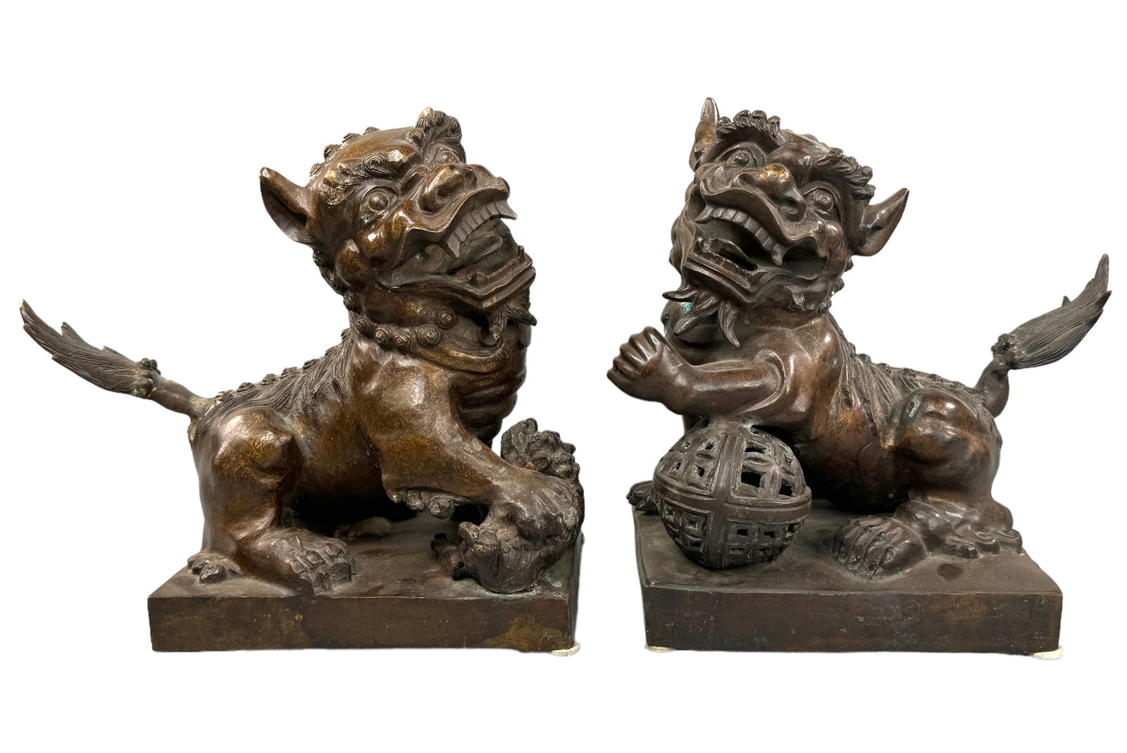 Longqing Antique Bronze Clad Foo Dog Guardians: 2 heavy antique Bronze foo dog/lion guardian statues. Both are character marked/signed as shown. Translator picks up MADE LONGQING. Possibly genuine to period!! Very interesting copper like etch creat