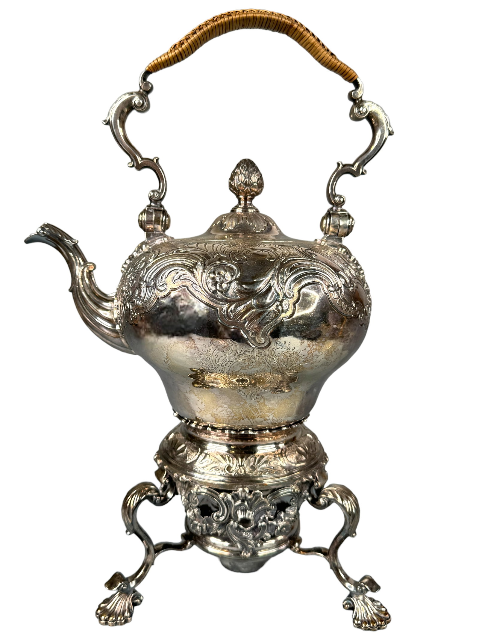 RARE Silver 1747 John Hugh Le Sage Teapot: A wonderful piece of silversmith history. This is a hallmarked pure silver tea pot and warming stand by John Hue Le Sage London. Stunning repousse and chase decoratives on both the pot and the warmer.