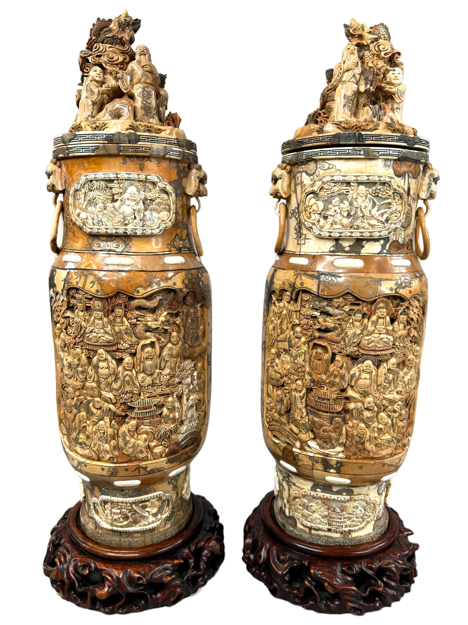 Antique Mammoth Tusk & Bone Panel Carved Urns: Incredibly detailed mammoth tusk & bone carved panel piece urns. May contain Mastodon. Both matching with oppositional figural tops but have different intricately carved scenes on the body. Absolutely