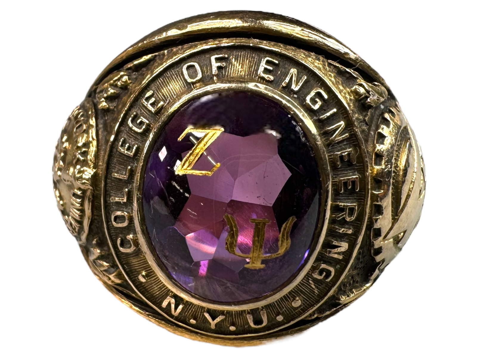 10k Amethyst 1956 NYU Engineering Ring: 10k Scholastica 1956 New York University College of Engineering ring. Has a back cut 12.5 x 10mm amethyst like set stone with inlaid gold Zeta Psi symbols. Engraved initials in inner band of J.N. Size