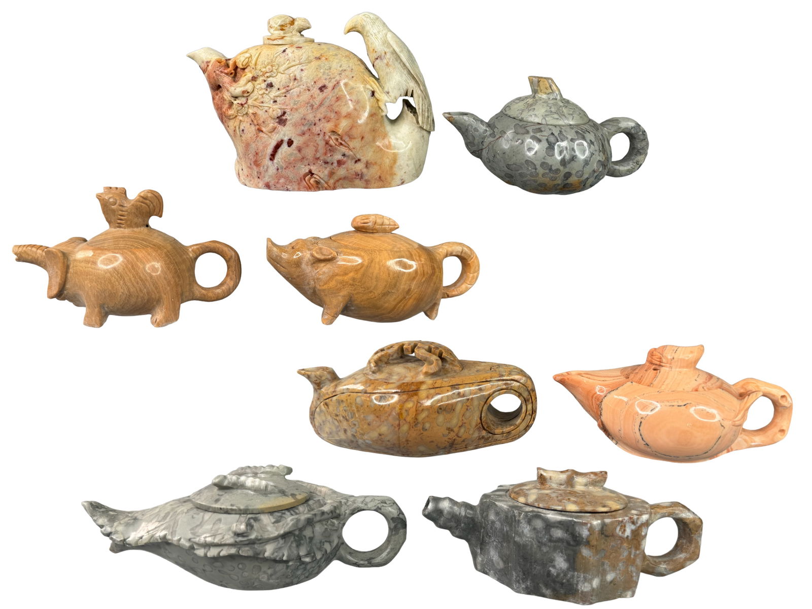 8 Carved Miniature Teapots, Genuine Stone: Genuine stone hand carved miniature Asian teapots. Stones include soapstone, disphyllum fossil stone, Shoushan stone, and Marble. All are unique. Largest stands 4 inches tall.