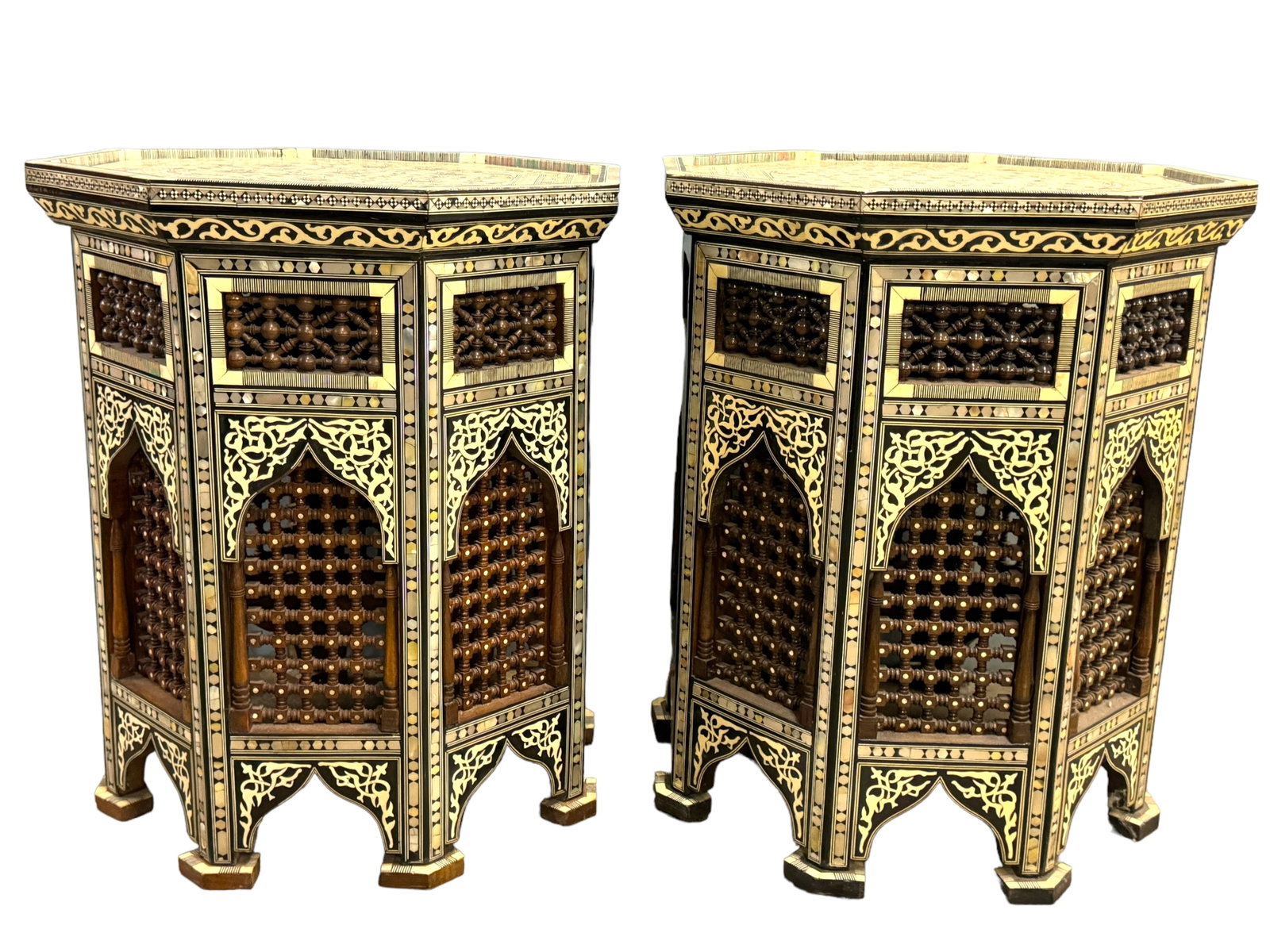 2 Intricate MOP Inlaid Octagonal Side Tables: Interesting Moroccan or Middle Eastern Intricate reticulated octagonal side tables in lacquered wood marquetry with geometric inlays of mother of pearl and bone. Each measures 23 x 19 x 19 inches. ***