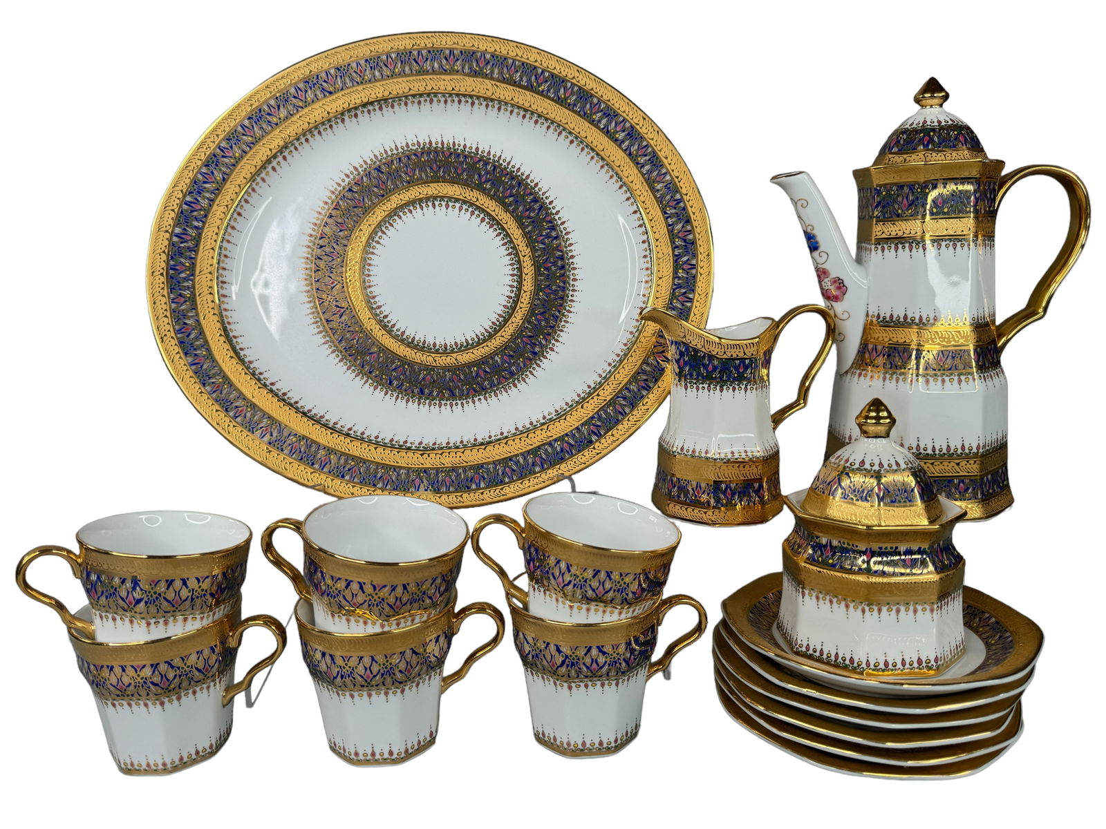 Hand Painted Taiwanese Porcelain Luncheon Set: Tea pot, sugar dish, Creamer, 6 cups and saucers and a platter. All are hand painted with intricate gilt work. The platter measures 13 x 12 inches.