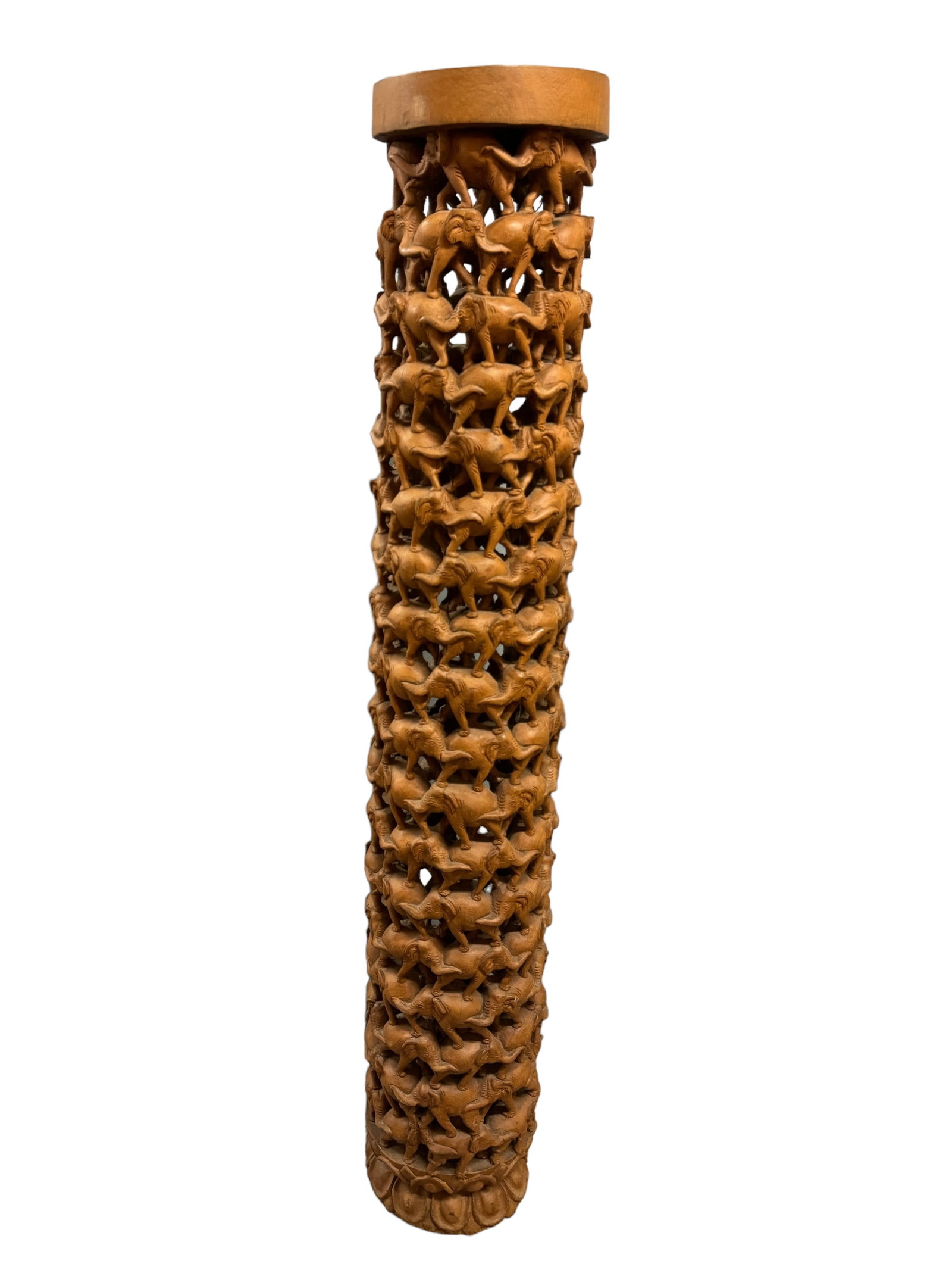 Carved Elephant Single Log Pedestal/Stand: Expertly hand carved from a single log of a light dense wood. Thai style import with interconnected elephants and a seemingly hollow center. It stands 61 inches tall! *** This item requires IN PERSON 