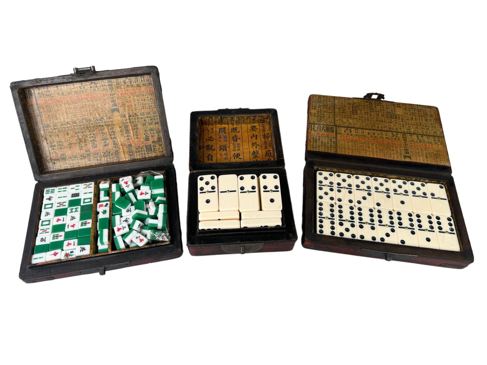 Vintage Asian Dominoes & Mahjong Sets: Mid century to more modern sets of dominoes and 1 mahjong tile set in vintage decorated boxes. All three sets are either untouched or barely played. The antiqued boxes with metal hinging have minor bu