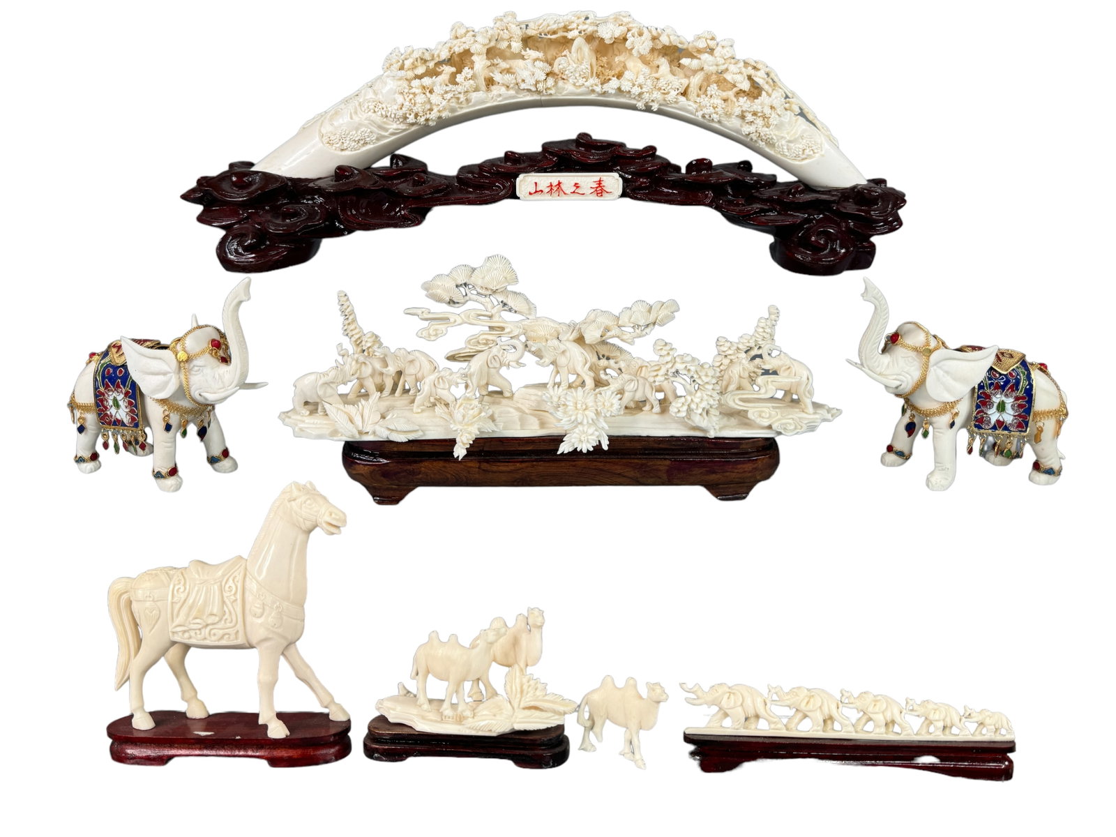 Collection Of Modern Asian Bone Carvings: A collection of highly detailed panel tusk form bone carving to stand alone miniature animals. All are unique. One elephant is missing an ear and a camel needs to be reaffixed. Largest is 17 inches in